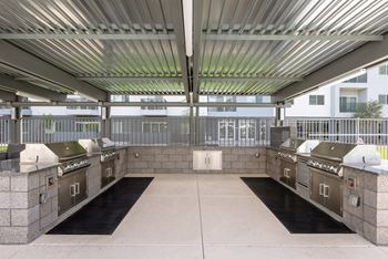 Al fresco kitchen with grilling stations and lounge seating